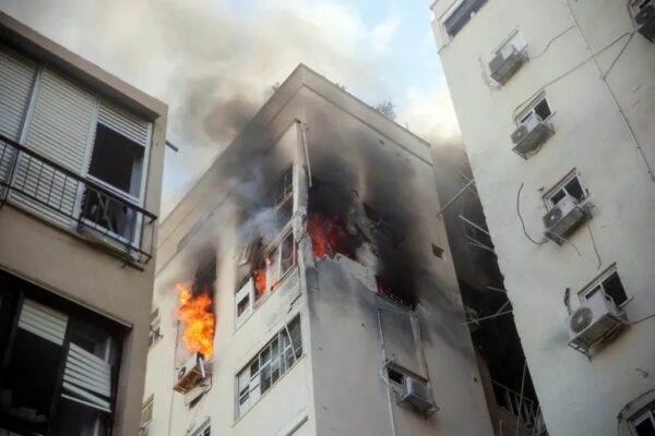 A building is ablaze following rocket attacks from the Gaza