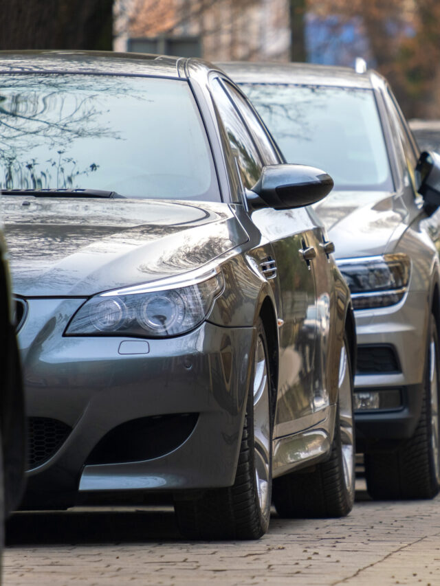 cars-parked-in-a-row-on-a-city-street-side-2024-12-06-22-29-04-utc