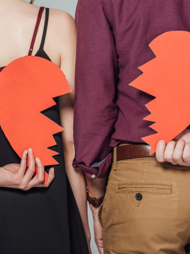 cropped-shot-of-young-couple-holding-broken-heart-2024-11-17-17-23-42-utc