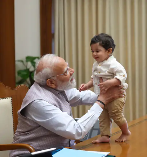 hjfqotfaeaeqema_1779626707 PM Modi Turns Child with Children